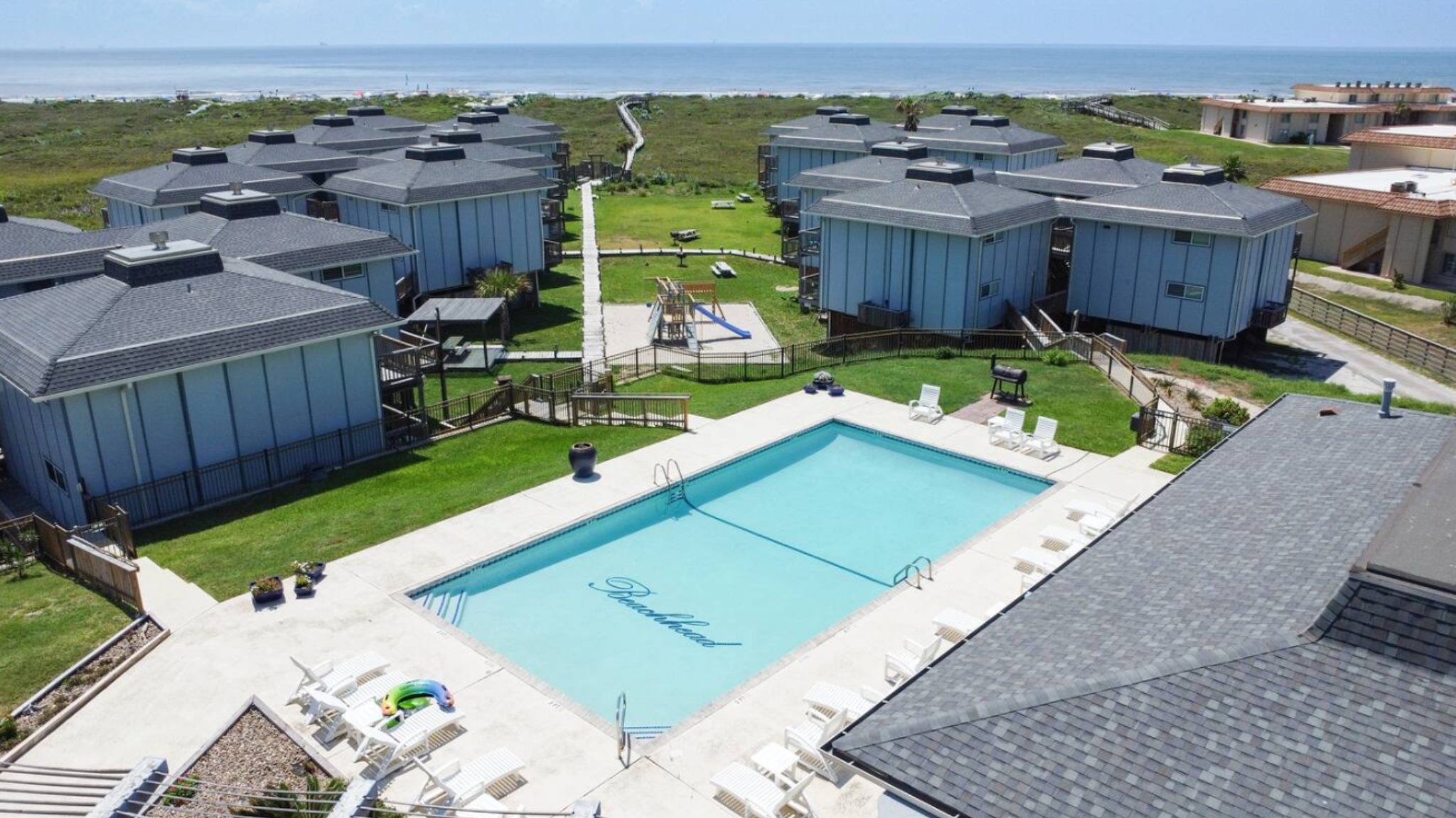 Pool and beachside community aerial view